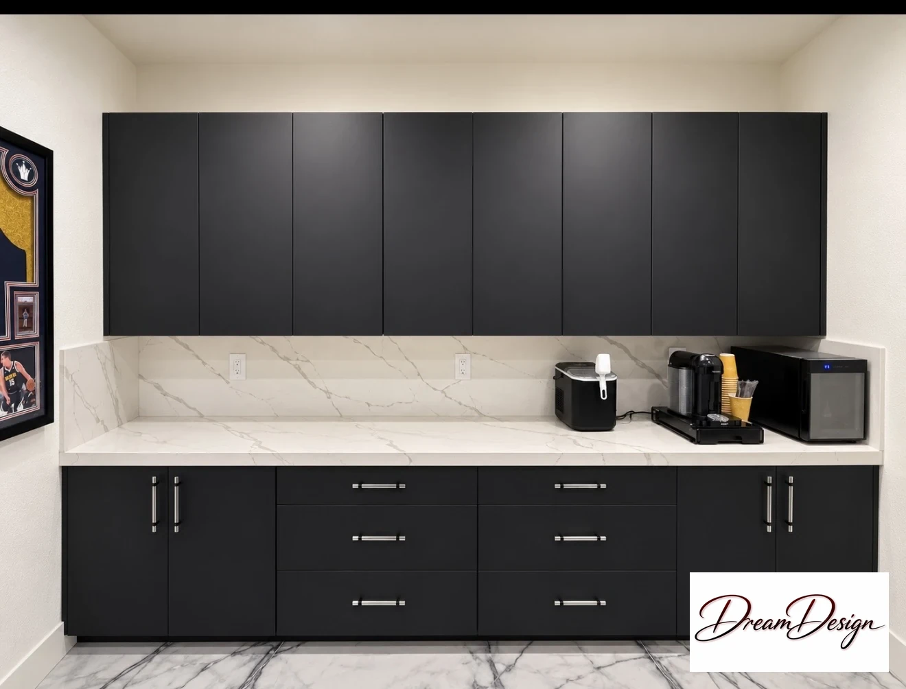 Black upper and lower beverage-station cabinetry with a light veined counter and backsplash.