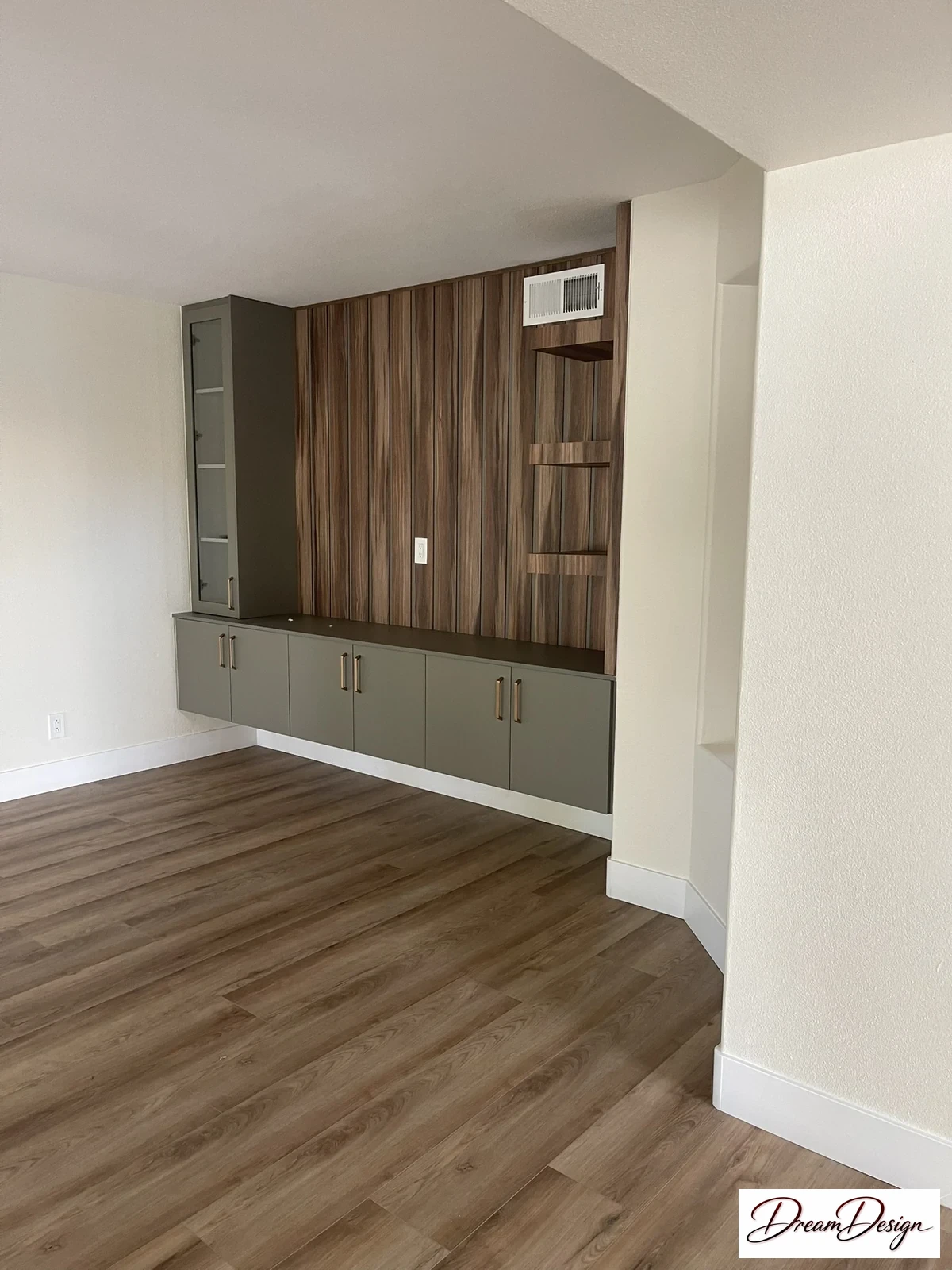 Wood-grain upper cabinetry and darker lower cabinets around a compact counter.