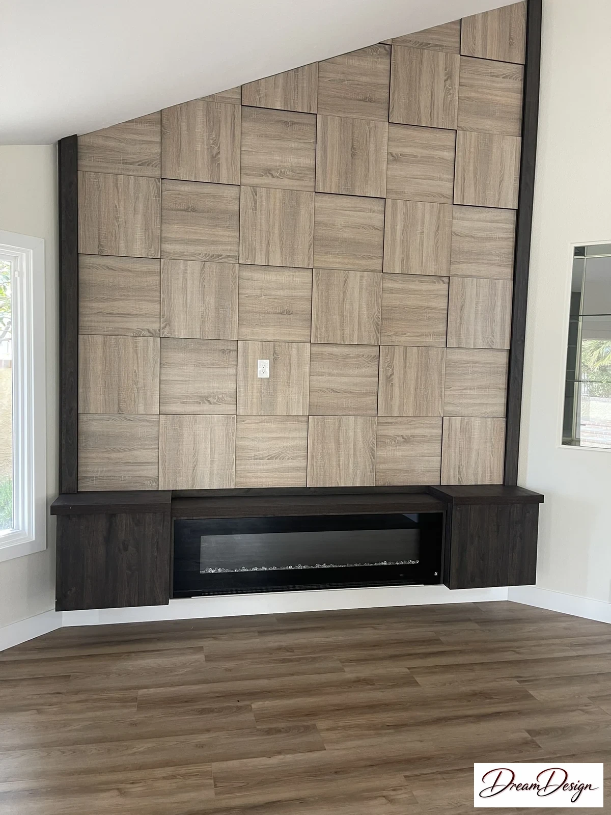 Tall patterned wood-tone wall panels above a dark linear fireplace.